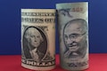 Rupee rises to 77.49 against dollar as crude oil eases