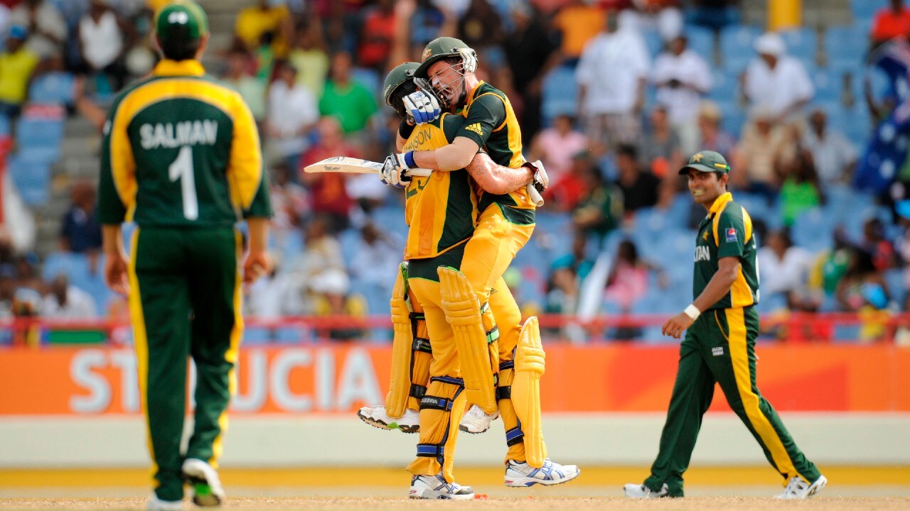 Australia's Michael Hussey is lifted by Mitchell Johnson as Pakistan's Salman Butt looks on after Australia defeated Pakistan after the second semi final in the ICC World Twenty20 tournament at Beausejour Cricket Ground in Gros Islet May 14, 2010 (Image: Reuters)