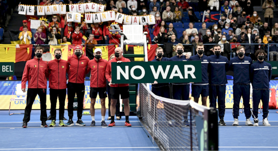 Finland and Belgium teams hold a banner reading &quot;No War&quot; before the match amid Russia's invasion of Ukraine. (Image: Reuters)