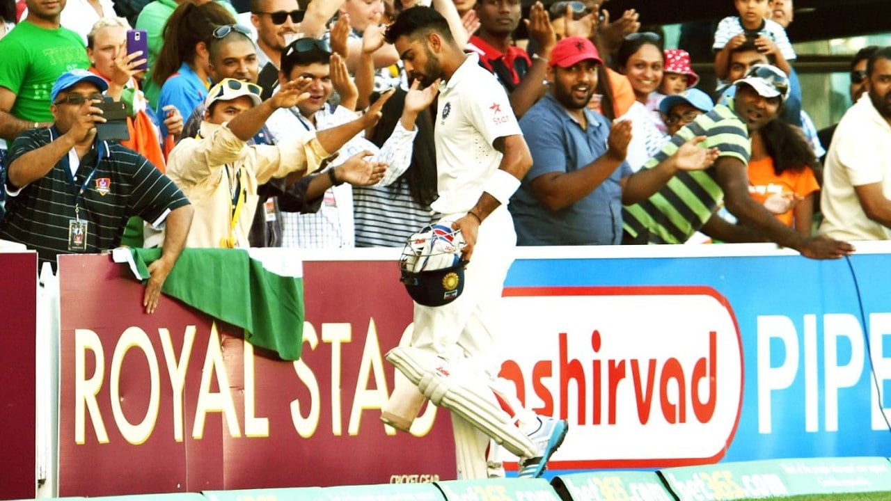 Virat Kohli walks back to a standing ovation after scoring his second hundred in the Test against Australia at Adelaide Oval (Image: AFP)