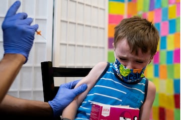 A 5-year-old receives a Pfizer-BioNTech coronavirus disease (COVID-19) booster vaccine. (Reuters)