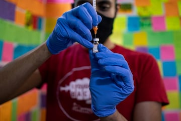 Dr. Mayank Amin draws a Pfizer-BioNTech coronavirus disease (COVID-19) children's booster vaccine. (Reuters)
