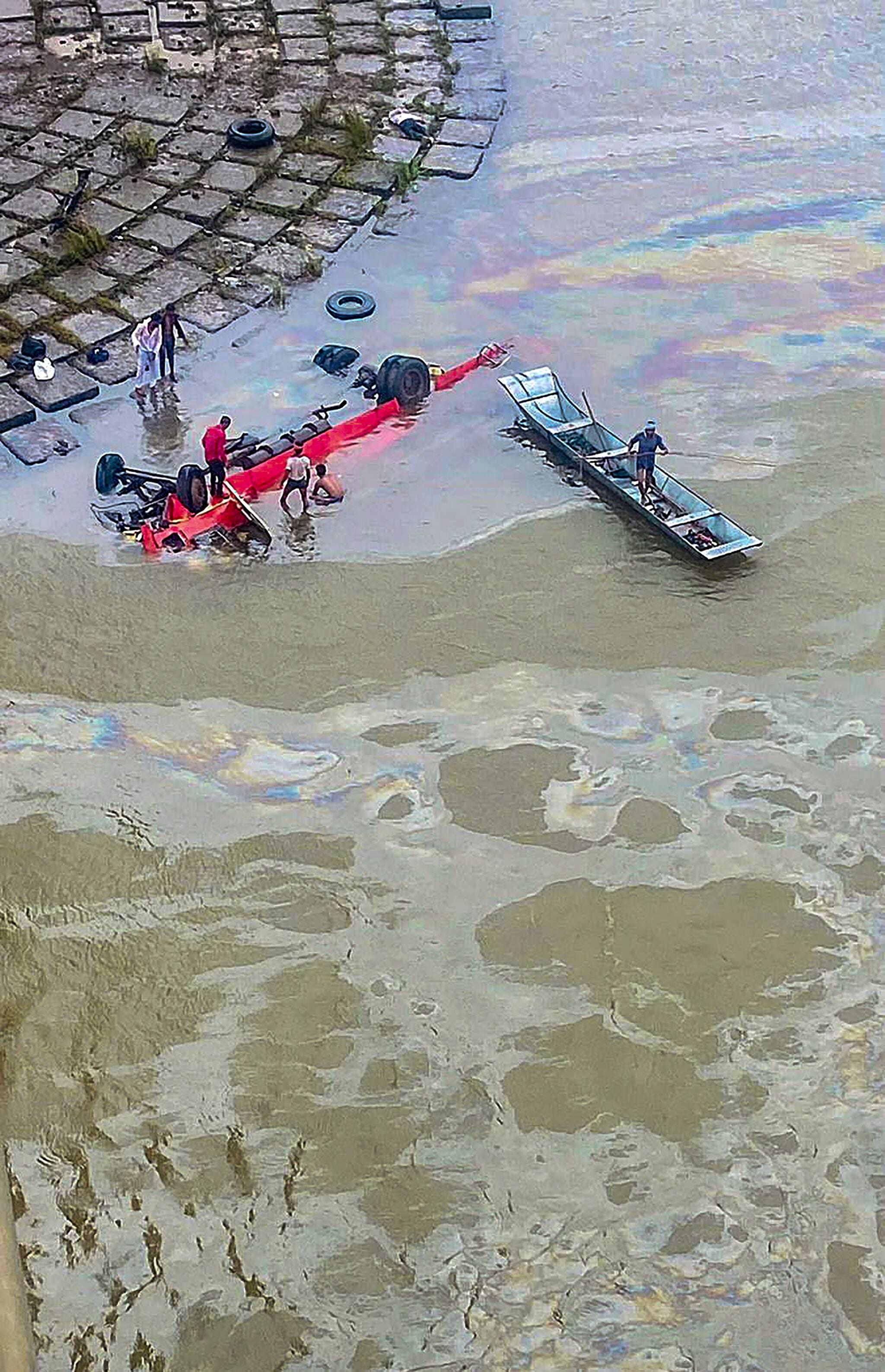 Dhar: Rescue operation underway after a Maharashtra State Road Transport Corporation (MSRTC) bus fell into the Narmada river, in Dhar district, Monday, July 18, 2022. At least 12 passengers were killed, according to officials. (PTI Photo)(