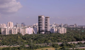 Noida: Buildings of Emerald Court and ATS Village societies, near Supertech's 40-storey twin towers, being covered ahead of the towers' scheduled demolition on Aug. 28, in Noida, Tuesday, Aug. 23, 2022. (PTI Photo)(