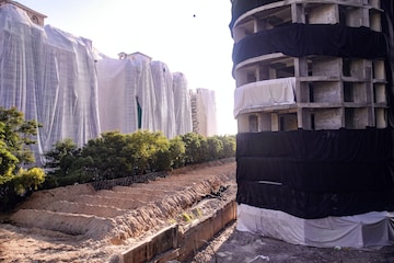 Noida: Buildings of a society near Supertech's 40-storey twin towers being covered ahead of the towers' scheduled demolition on Aug. 28, in Noida, Tuesday, Aug. 23, 2022. (PTI Photo)(