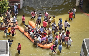 Bengaluru: Fire fighters evacuate residents from flooded Rainbow Drive Layout after heavy monsoon rains at Sarjapur, in Bengaluru, Monday, Sept. 5, 2022. (PTI Photo/Shailendra Bhojak) (