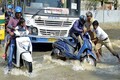 Bengaluru rains: After techies on tractors, visuals show school kids crossing submerged bridge on bulldozer