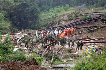 Rescuers conduct a search operation at the site of a landslide in Mimata, Miyazaki Prefecture, southern Japan, Monday Sept. 19, 2022. Powerful Typhoon Nanmadol slammed ashore in southern Japan on Sunday as it pounded the region with strong winds and heavy rain, causing blackouts, paralyzing ground and air transportation and prompting the evacuation of thousands of people.AP/PTI(