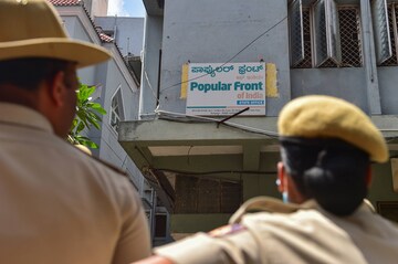 Bengaluru: Security personnel keep vigil outside the Popular Front of India (PFI) party office in Bengaluru, Thursday, Sept. 22, 2022. A multi-agency operation was spearheaded by the National Investigation Agency (NIA) on the PFI in 11 states for allegedly supporting terror activities in the country. (PTI Photo)(