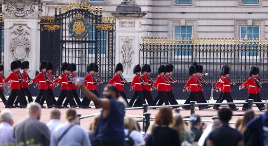 Royal procession from Buckingham Palace to Westminster Hall, crowds gather to pay their respects
