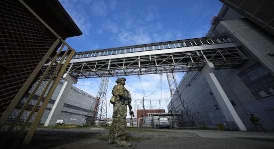 A Russian serviceman guards an area of the Zaporizhzhia Nuclear Power Station in territory under Russian military control, southeastern Ukraine, May 1, 2022. Ukraine’s Zaporizhzhia nuclear power plant , built during the Soviet era and one of the 10 biggest in the world, has been engulfed by fighting between Russian and Ukrainian troops in recent weeks, fueling concerns of a nuclear catastrophe. (AP Photo, File)