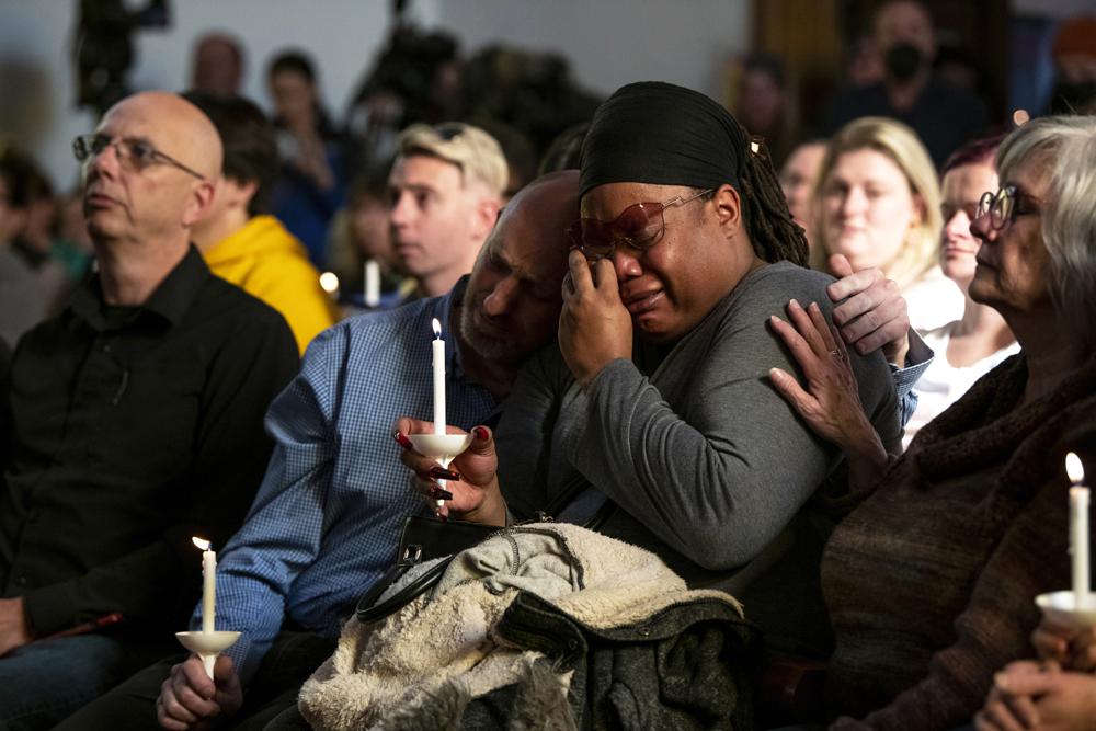 Tyrice Kelley, center right, a performer at Club Q, is comforted during a service held at All Souls Unitarian Church following an overnight fatal shooting at the gay nightclub