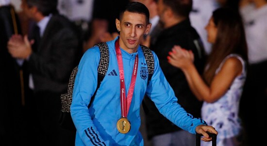 Veteran Angel Di Maria who scored the team's crucial second goal in the final spotted at at Ezeiza International Airport proudly wearing his winner's medal around his neck. (Image: Reuters)