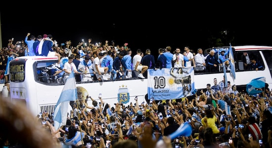 Fans gather outside the Association of Argentinian Football Headquarters as the Argentina team bus arrives