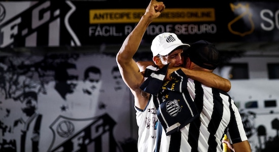Fans of Pele's childhood club, Santos, in tears on getting the news of the death of the great footballer. (Image: Reuters) Fans of Pele's childhood club, Santos, in tears on getting the news of the death of the great footballer. (Image: Reuters)