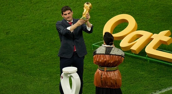 Former Spanish footballer Iker Casillas holds the winner's trophy ahead of the World Cup final soccer match between Argentina and France at the Lusail Stadium in Lusail, Qata Former Spanish footballer Iker Casillas holds the winner's trophy ahead of the World Cup final soccer match between Argentina and France at the Lusail Stadium in Lusail, Qata