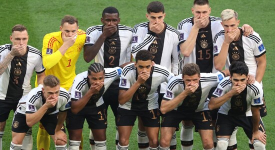 Germany players cover mouths in team photo before match against Japan | The German players protested after FIFA's threat of sanctions over the "OneLove" armband continued.All German players took part in the gesture in front of dozens of photographers on the pitch ahead of kickoff, after world soccer body FIFA had threatened seven European teams with sanctions if they wore the armband symbolizing diversity and tolerance. Germany players cover mouths in team photo before match against Japan | The German players protested after FIFA's threat of sanctions over the "OneLove" armband continued.All German players took part in the gesture in front of dozens of photographers on the pitch ahead of kickoff, after world soccer body FIFA had threatened seven European teams with sanctions if they wore the armband symbolizing diversity and tolerance.