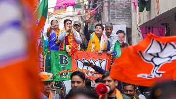 Union Minister for Commerce and Industry Piyush Goyal waves at supporters during a BJP election campaign roadshow for the upcoming MCD elections, at Mandawali in New Delhi. (PTI)