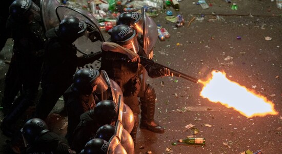 Riot police fires a shotgun as they clear remaining footballing fans who waited for hours for a homecoming parade. parade to celebrate the champions was abruptly cut short Tuesday as millions of people poured onto thoroughfares, highways and overpasses in a chaotic attempt to catch a glimpse of the national team Riot police fires a shotgun as they clear remaining footballing fans who waited for hours for a homecoming parade. parade to celebrate the champions was abruptly cut short Tuesday as millions of people poured onto thoroughfares, highways and overpasses in a chaotic attempt to catch a glimpse of the national team