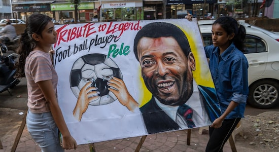 Students of Mumbai's Gurukul art school carry an art work paying tribute to football legend Pele. (Image: AP) Students of Mumbai's Gurukul art school carry an art work paying tribute to football legend Pele. (Image: AP)