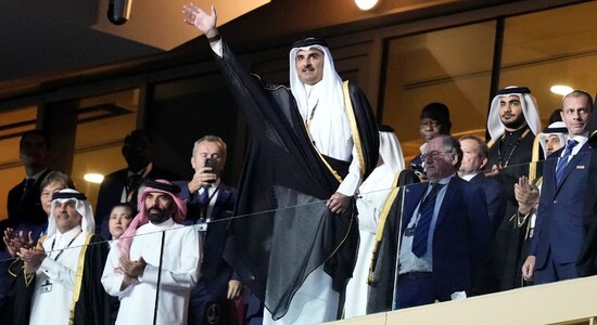 The Emir of Qatar Sheikh Tamim bin Hamad Al Thani waves as he arrives on the tribune ahead of the World Cup final soccer match between Argentina and France at the Lusail Stadium in Lusail, Qatar The Emir of Qatar Sheikh Tamim bin Hamad Al Thani waves as he arrives on the tribune ahead of the World Cup final soccer match between Argentina and France at the Lusail Stadium in Lusail, Qatar