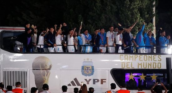  Argentina's World Cup winning players with the trophy after the team's arrival at Ezeiza International Airport in 