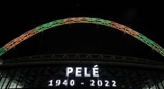 The iconic Wembley Stadium's arch is lit up in the colours of Brazil after it was announced that the former Brazilian footballer Pele had died. (Image: AP) The iconic Wembley Stadium's arch is lit up in the colours of Brazil after it was announced that the former Brazilian footballer Pele had died. (Image: AP)