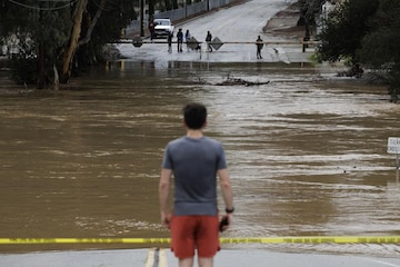Uvas Creek floods a section of Miller Avenue in Gilroy, Calif., as the latest series of atmospheric rivers hit the Bay Area on Monday, Jan. 9, 2023.