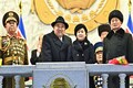 North Korea's Kim Jong Un shows off daughter, missiles at military parade