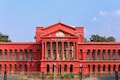 Bengaluru High Court orders restoration of housekeeping workmen's services as employees