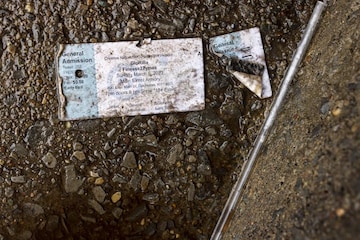 A concert ticket for GloRilla and Finesse2Tymes is seen on the stairs leading up to the Main Street Armory on Monday, March 6, 2023 (Image: AP)
