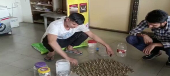 Assam shopkeeper pays for dream scooter in coins