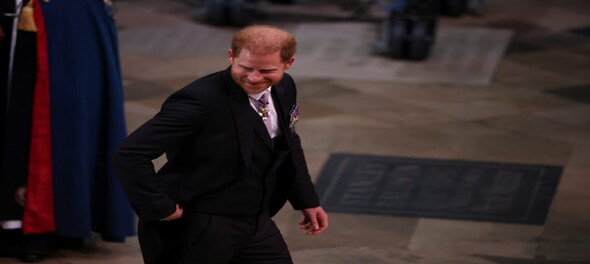 King Charles Coronation: Smiling Prince Harry arrives at Westminster Abbey