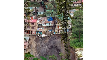 Shimla: Buildings are seen at Krishnanagar area where houses collapsed after a landslide, in Shimla, Wednesday, Aug. 16, 2023. (PTI Photo)