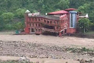 **EDS: SCREENSHOT VIA PTI VIDEO ON MONDAY, AUG 14, 2023** Dehradun: The Doon Defense College building collapses near Dehradun due to the incessant rains, near Dehradoon. (PTI Photo) (