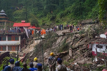 Shimla: Police, district administration and locals carry out rescue operation after collapse of a temple following a massive landslide near Summer Hill in Shimla, Monday, Aug. 14. 2023. At least 9 people have been killed. (PTI Photo) (