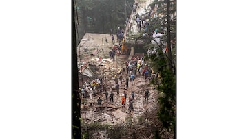 Shimla: Rescue and relief work underway after collapse of a temple following a massive landslide near Summer Hill in Shimla, Monday, Aug. 14. 2023. (Credit: PTI)