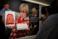 Princess Diana's iconic black sheep sweater fetches over a million dollars at Sotheby's auction in dramatic fashion
