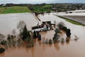 Britain hit by flooding after heavy rain swells major rivers