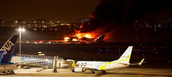 Japan Airlines plane in flames at Tokyo's Haneda Airport; Airbus sends team to probe collision