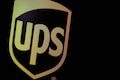 UPS to cut 12,000 jobs, bring workers in five days a week