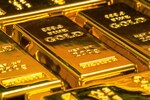 Gold steady after surging to record on rate-cut bets, haven bids