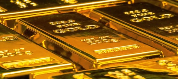 Gold prices rise on weak dollar, safe-haven demand