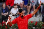 Novak Djokovic says he's "fine" after being hit on the head by a water bottle
